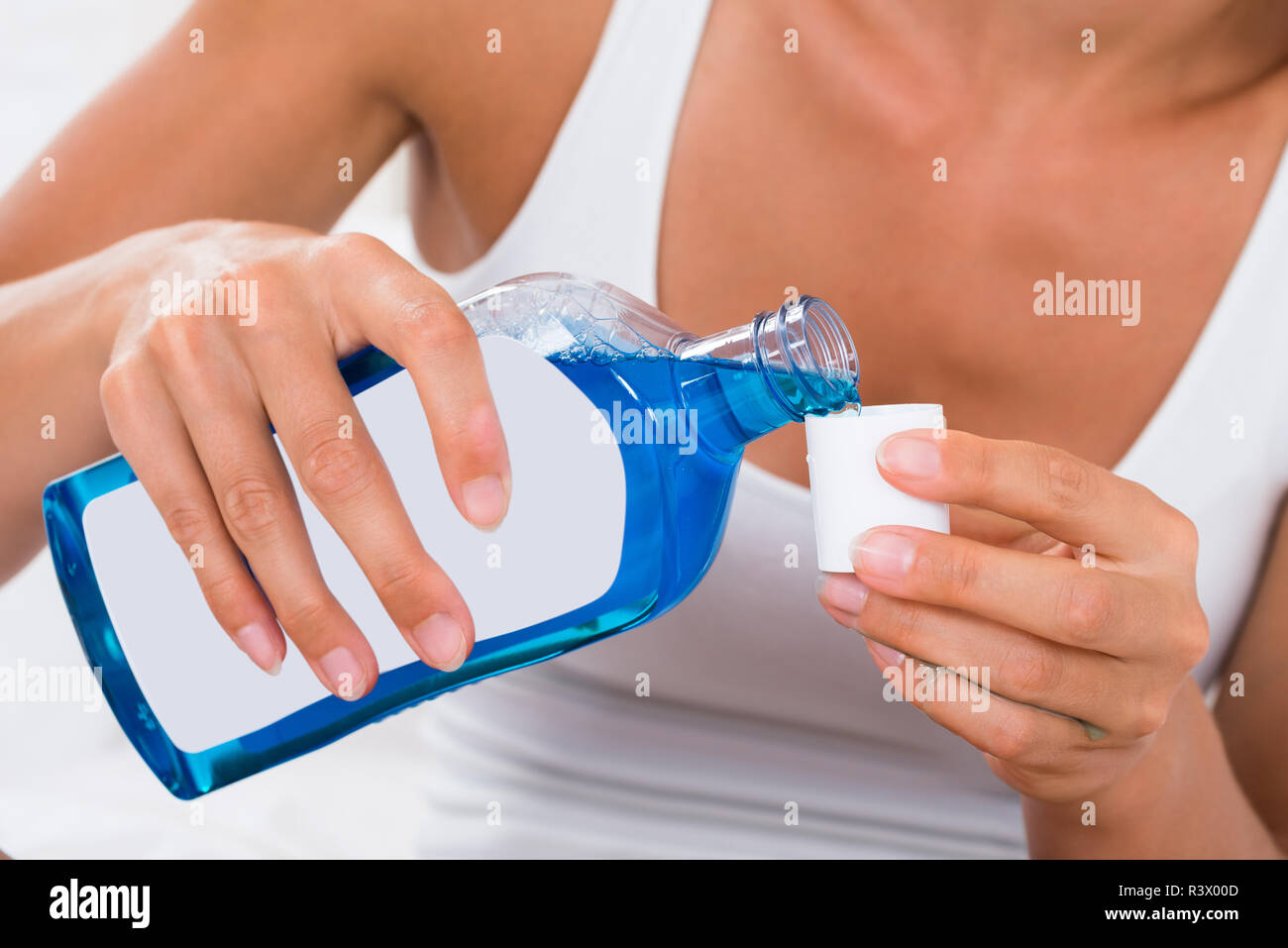 Woman Pouring Mouthwash Into Bottle Cap Stock Photo Alamy