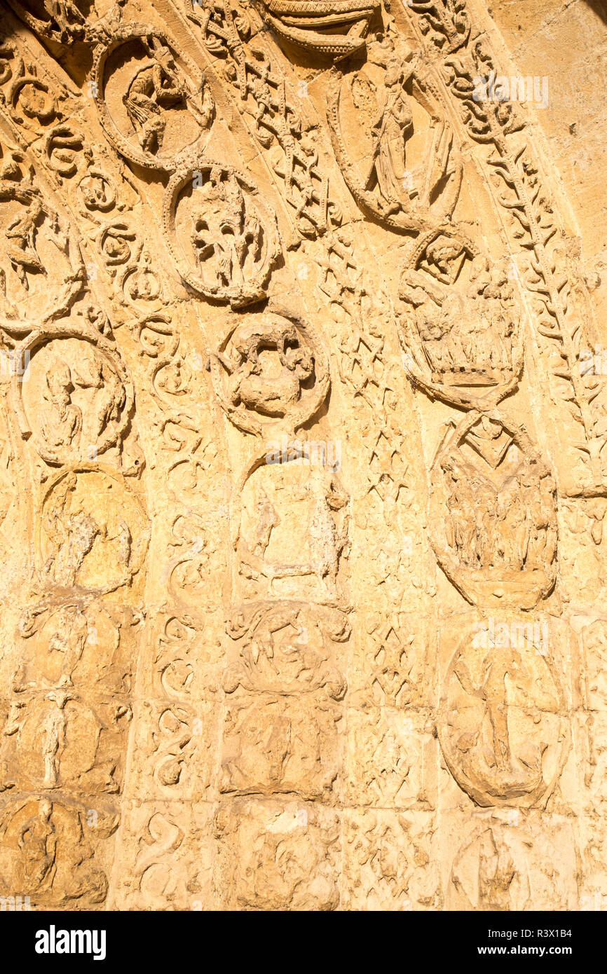 Carved stonework in entrance archway of Malmesbury abbey church, Malmesbury, Wiltshire, England, UK Stock Photo