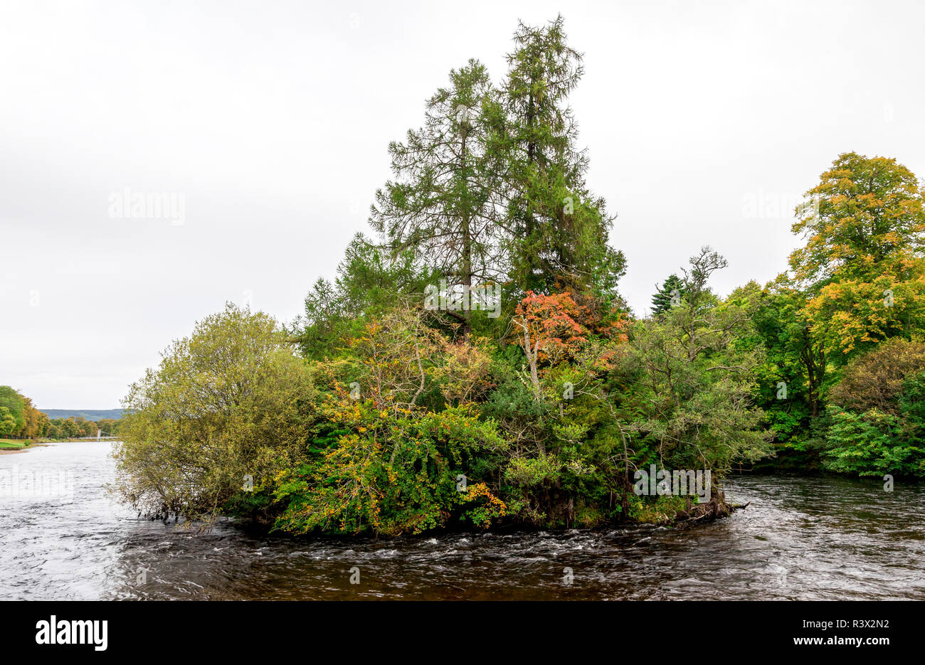 River Ness flowing through one of the small islands early in the morning in autumn, Inverness, Scotland Stock Photo