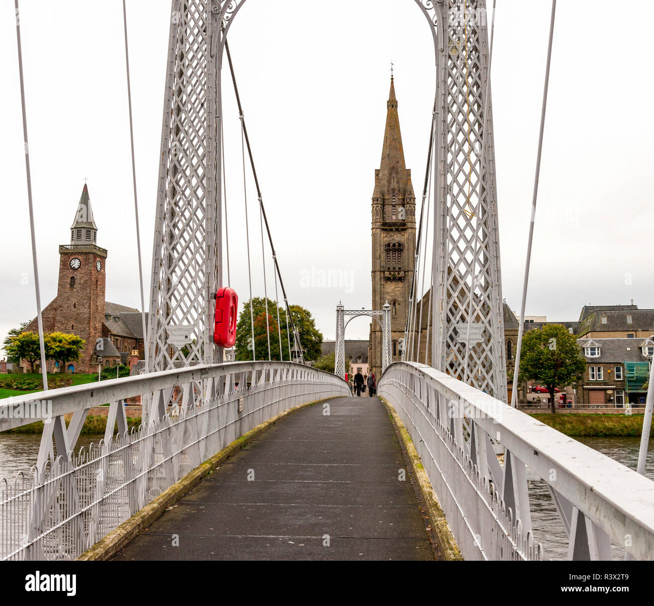 Crossing Greig Street Bridge over river Ness to reach Free Church of Scotland and Old High Church, Inverness, Scotland Stock Photo