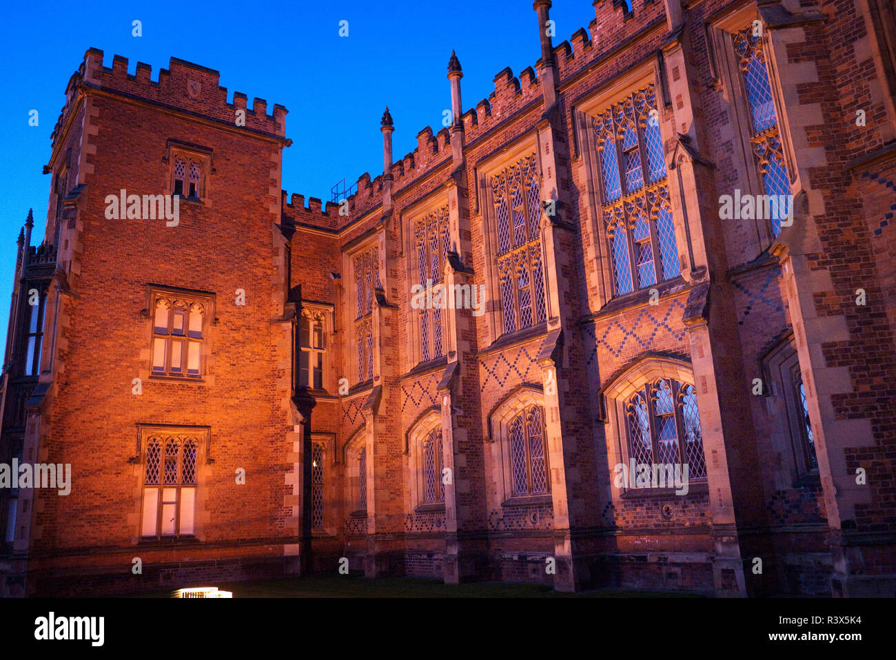 Front facade of the Lanyon Building, Queen's University, Belfast, Northern Ireland at night. Stock Photo