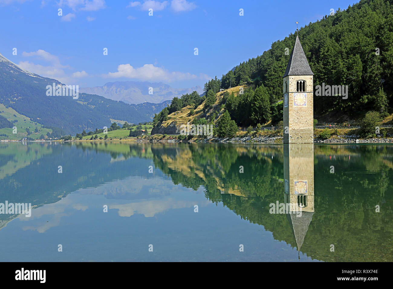 church tower in reschensee in vinschgau with reflection Stock Photo