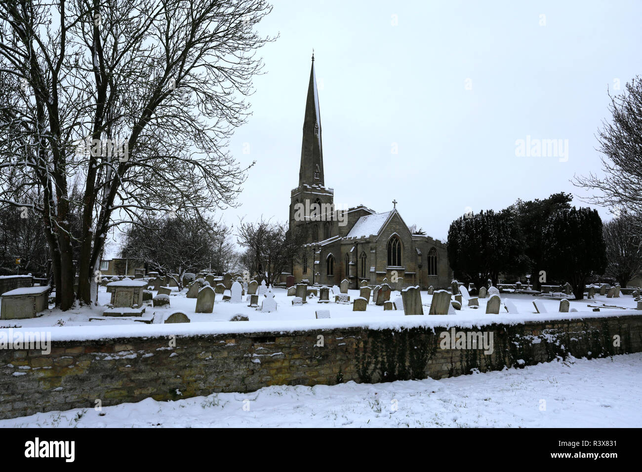 Snow on St Benedicts church, Glinton village, Cambridgeshire England UK