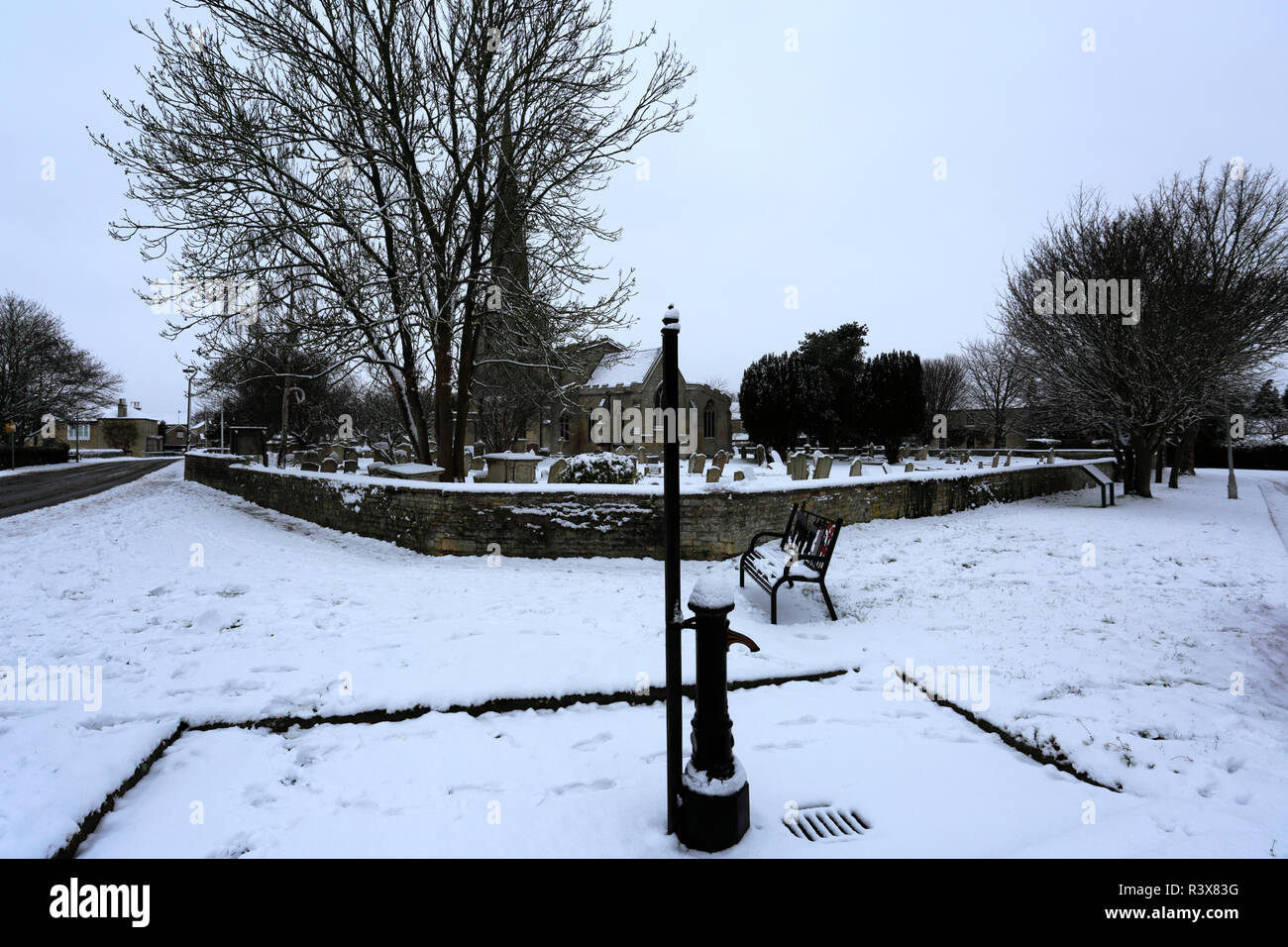 Snow on St Benedicts church, Glinton village, Cambridgeshire England UK
