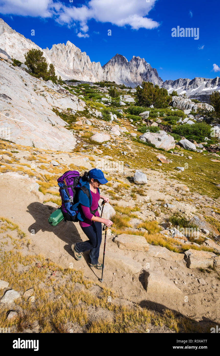 Backpacker on the Bishop Pass trail in Dusy Basin, Kings Canyon National Park, California, USA (MR) Stock Photo