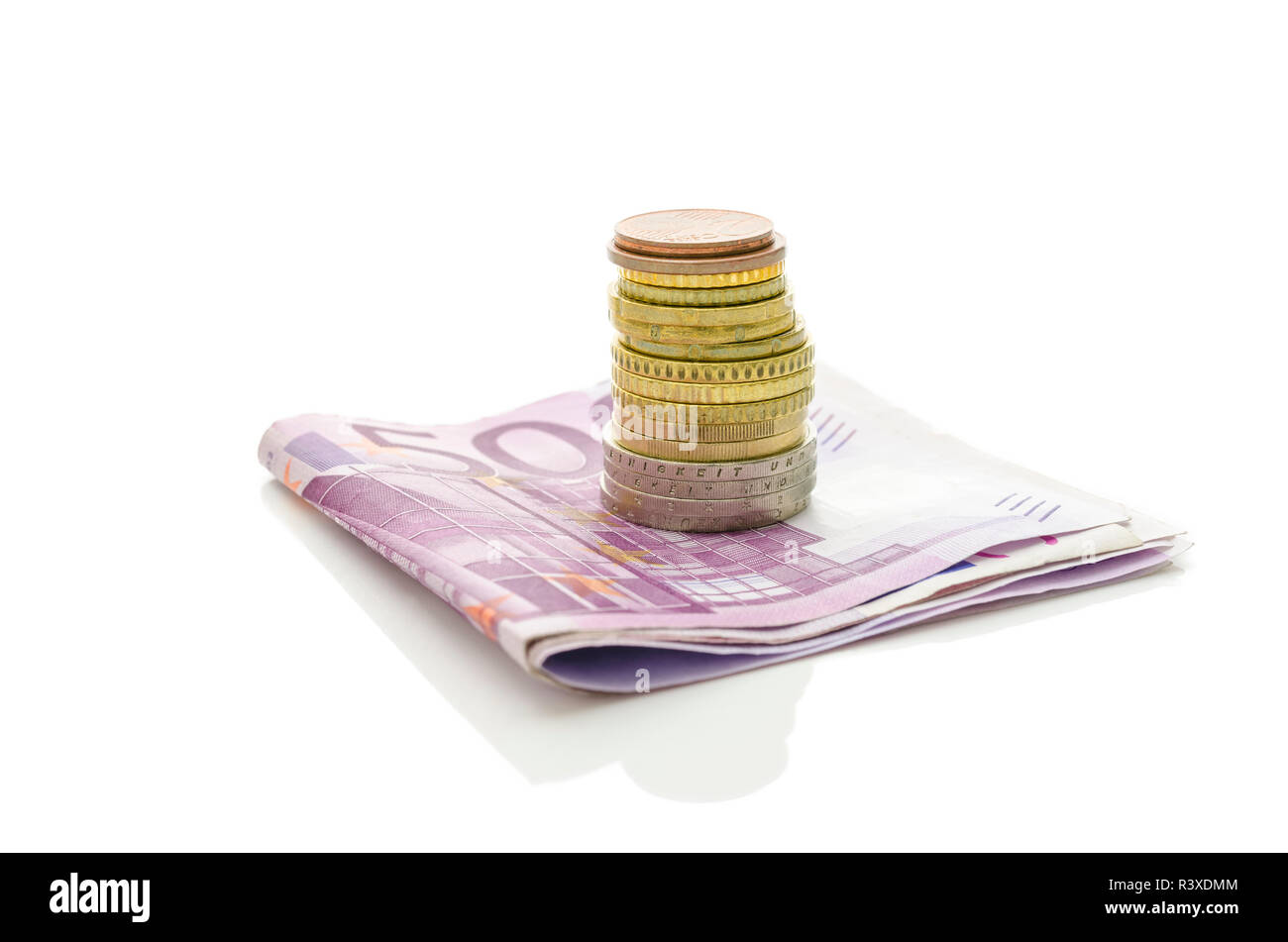 Stack of Euro coins on banknotes. Isolated over white background Stock ...
