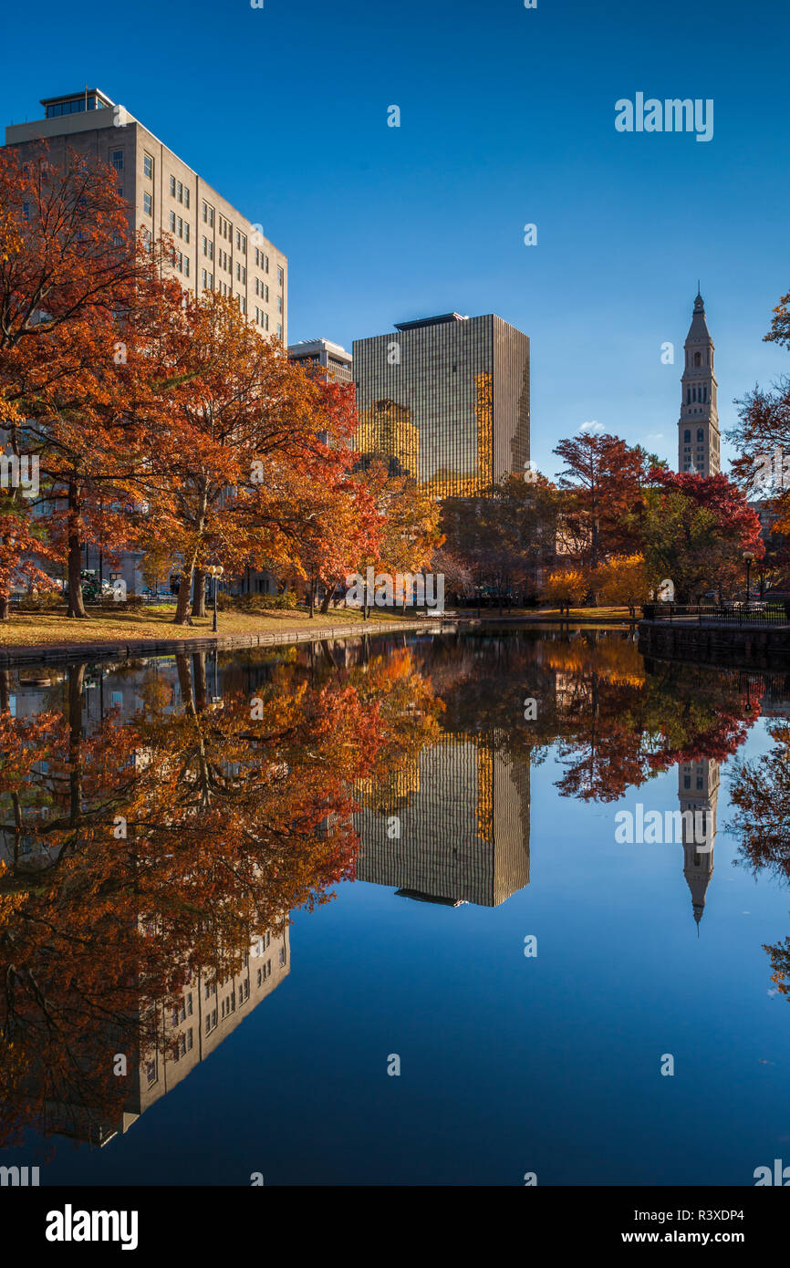 USA, Connecticut, Hartford, Bushnell Park, reflection of office buildings and Travelers Tower, Headquarters of the Travelers Insurance Company Stock Photo