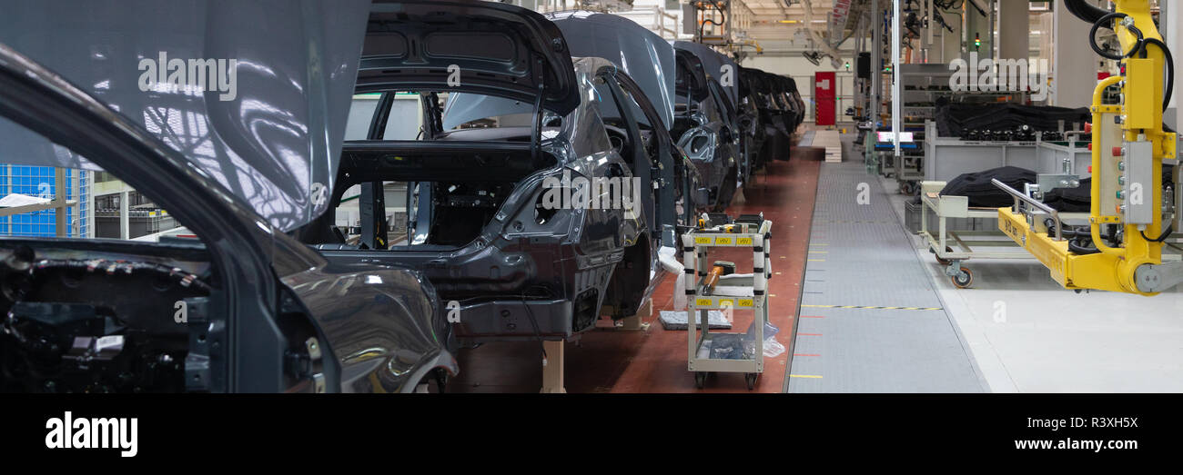 frame of car body. Long format. Wide angle view of plant of automotive industry. Can be used as banner Stock Photo