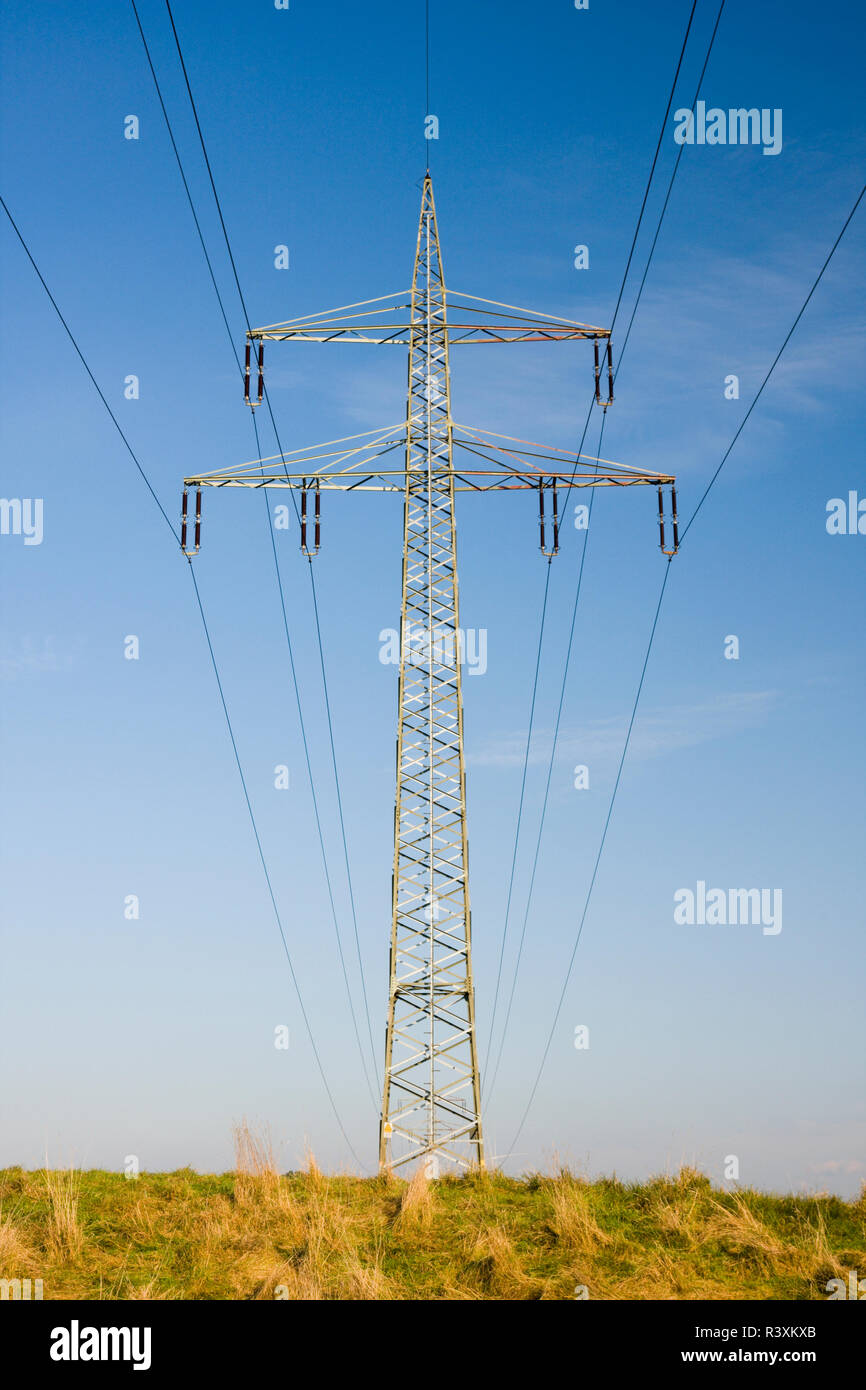 An electricity pylon symmetric seen from below. Stock Photo