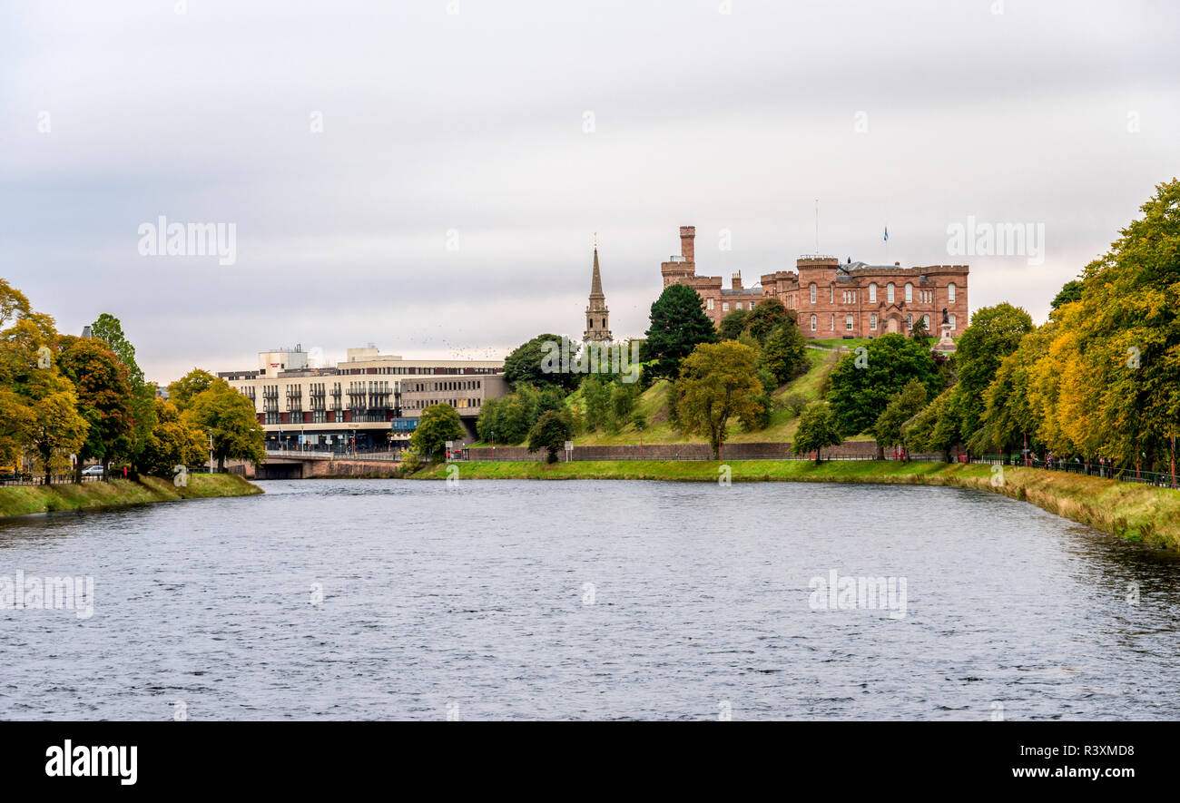 Inverness Castle on a cliff overlooking river Ness flowing through the city in early autumn, northern Scotland Stock Photo