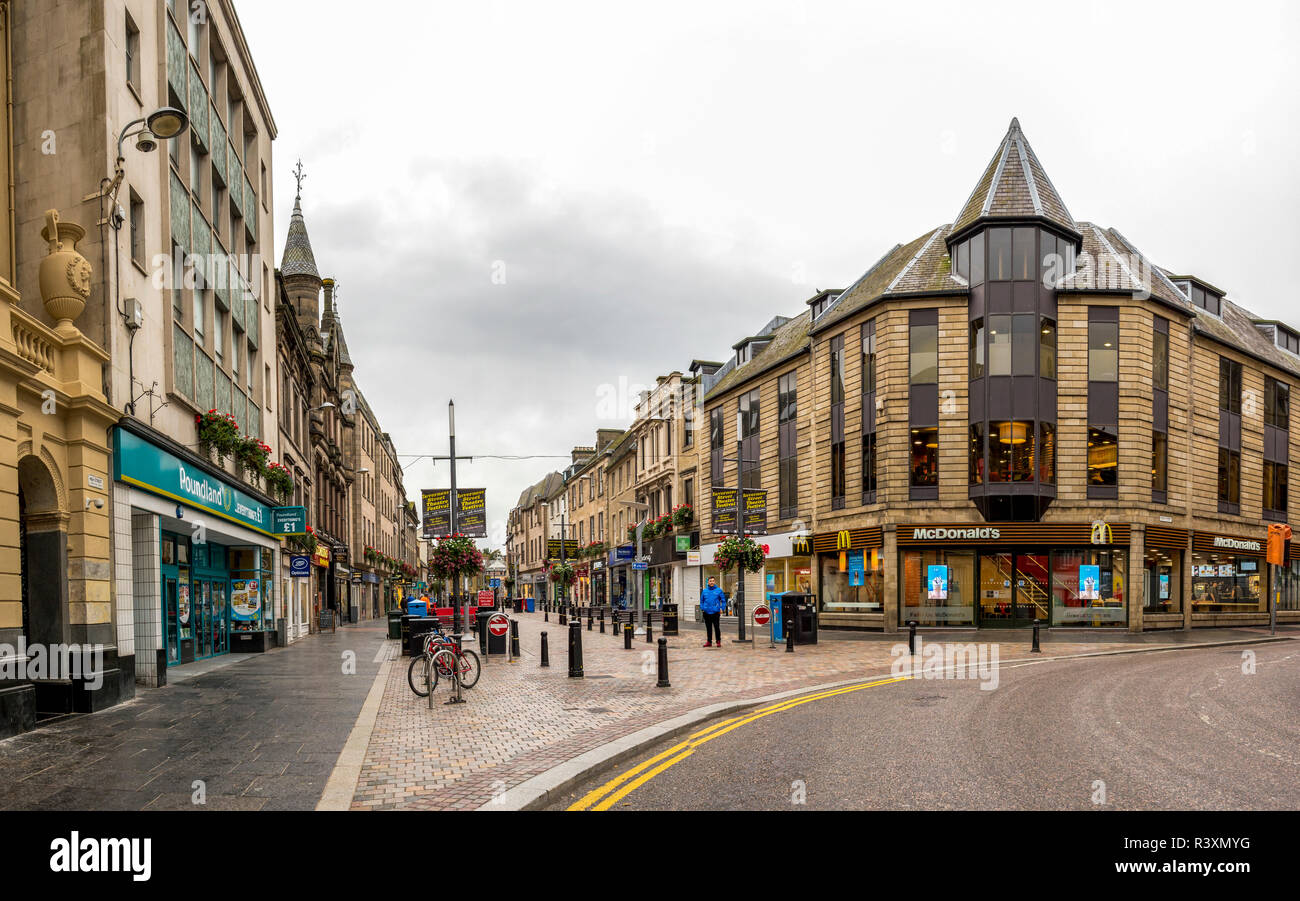 Start of pedestrian walking High Street in Inverness city centre with McDonald's fast food restaurant on a corner. Popular for shopping and dining amo Stock Photo