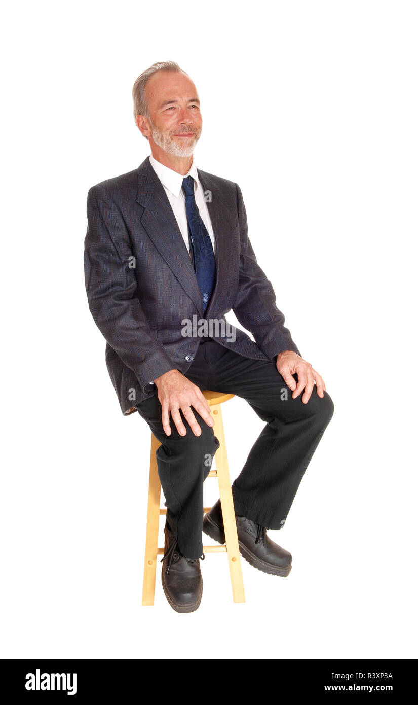 Middle age professional man sitting on a chair Stock Photo Alamy