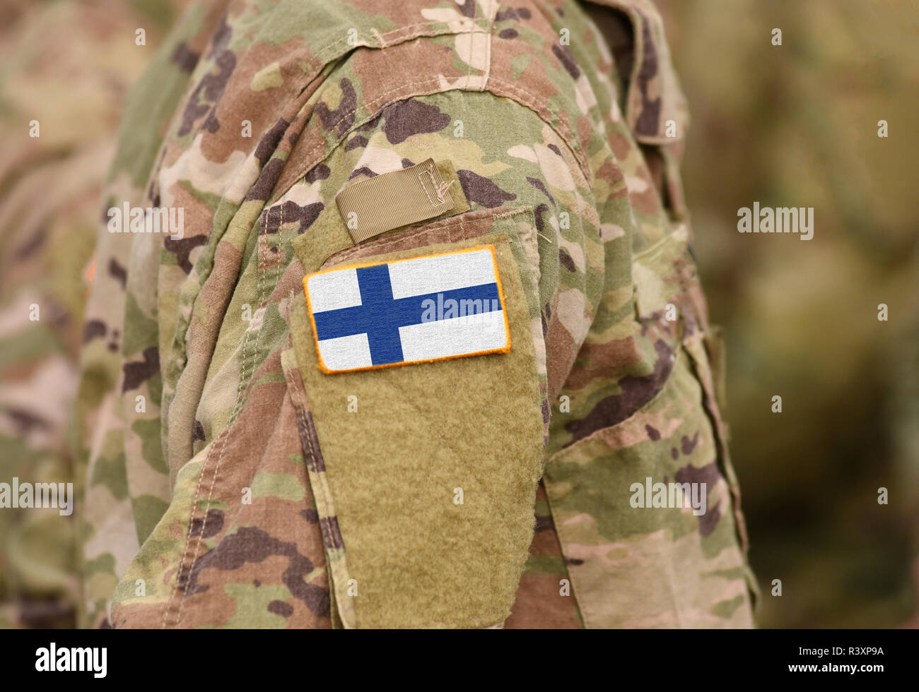 Finland flag on soldiers arm (collage). Stock Photo