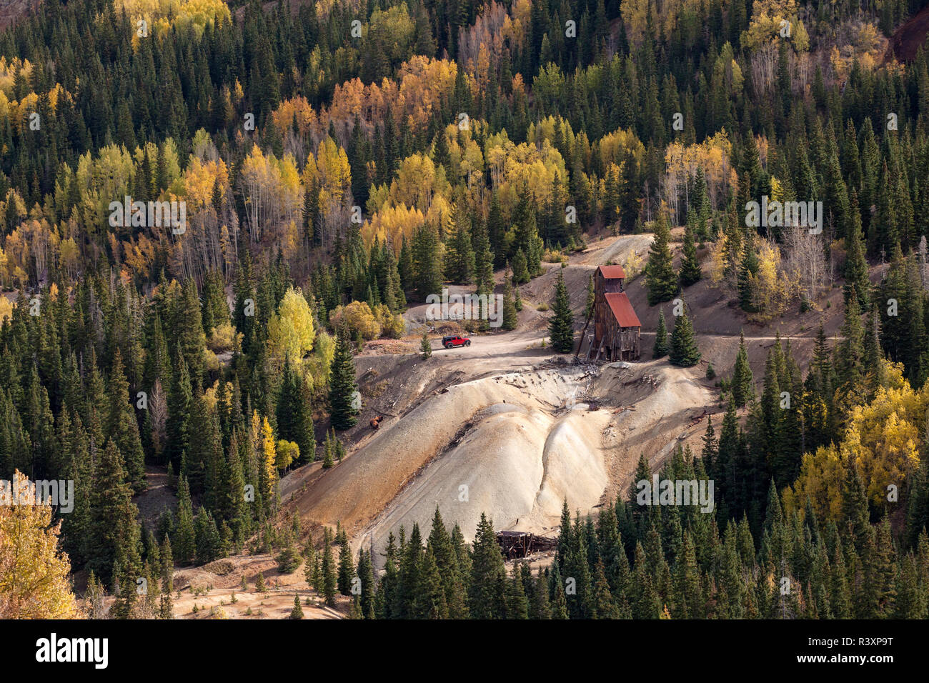 USA, Colorado, San Juan Mountains. Abandoned mine amid forest. Stock Photo