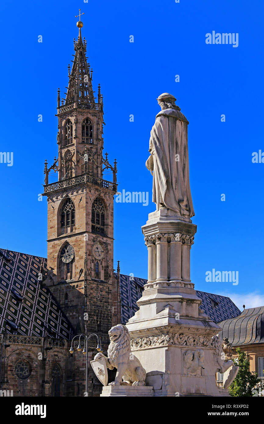 walter monument and tower of the cathedral maria assumption in bolzano Stock Photo