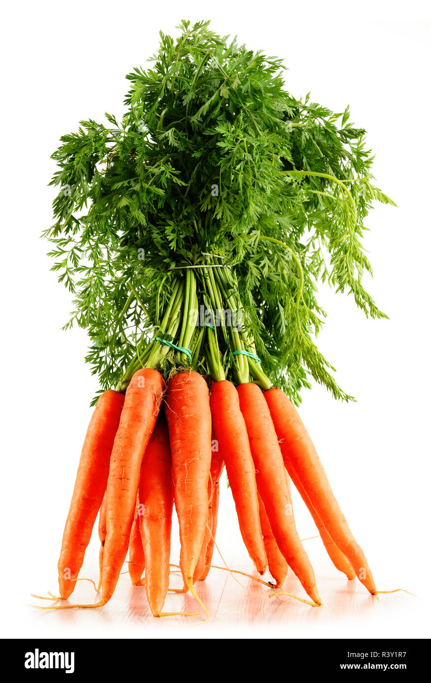 Fresh carrots bunch isolated on white Stock Photo