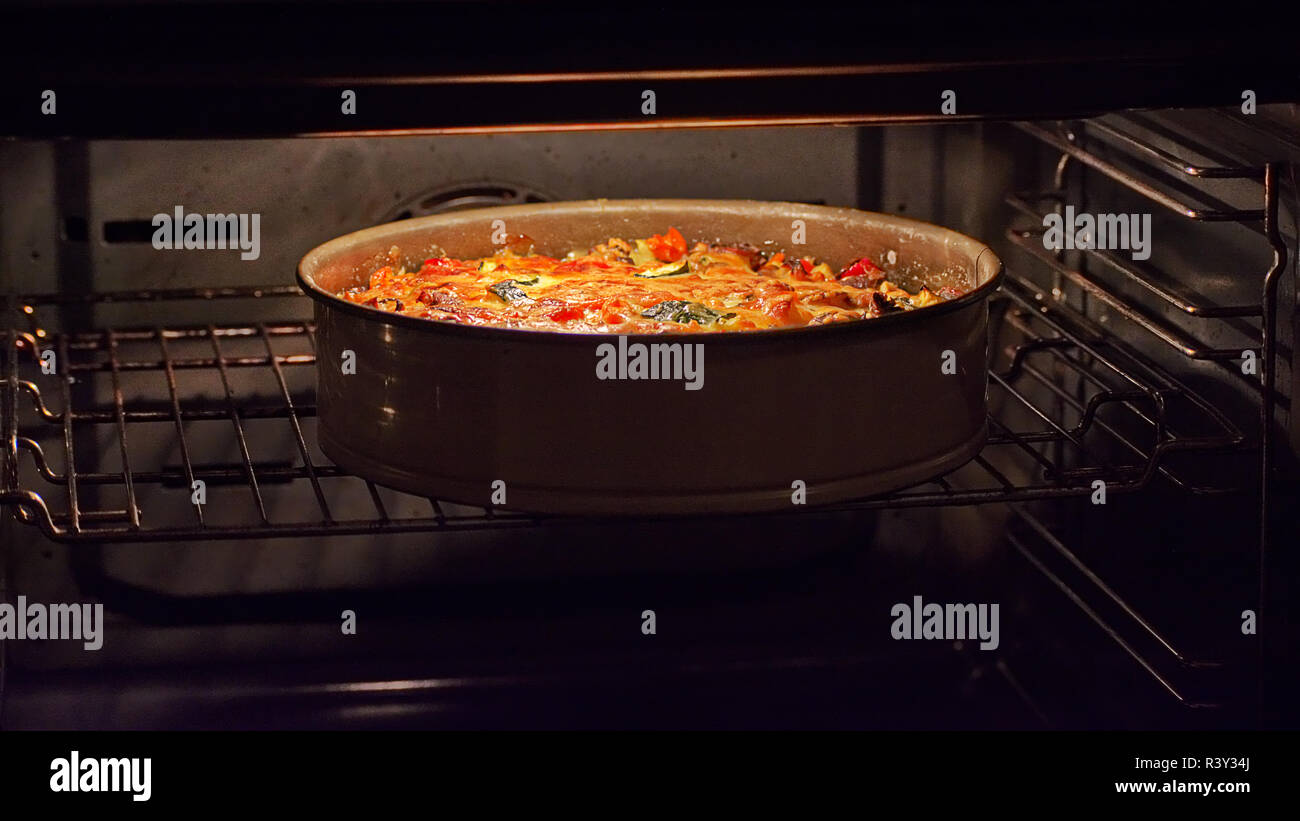 vegetable quiche in the oven Stock Photo - Alamy