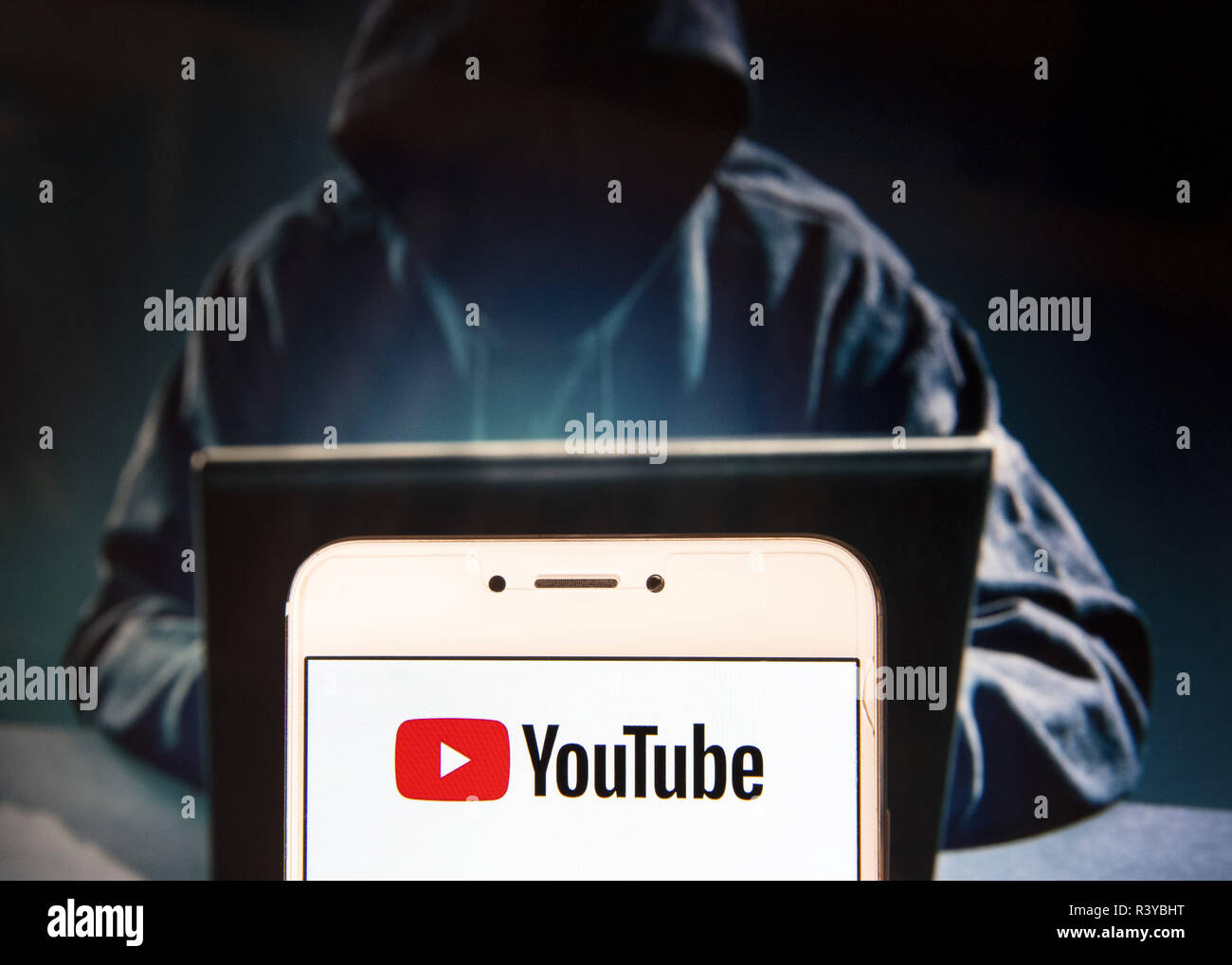 Hong Kong. 22nd Nov, 2018. American video-sharing website Youtube logo is  seen on an Android mobile device with a figure of hacker in the background.  Credit: Miguel Candela/SOPA Images/ZUMA Wire/Alamy Live News