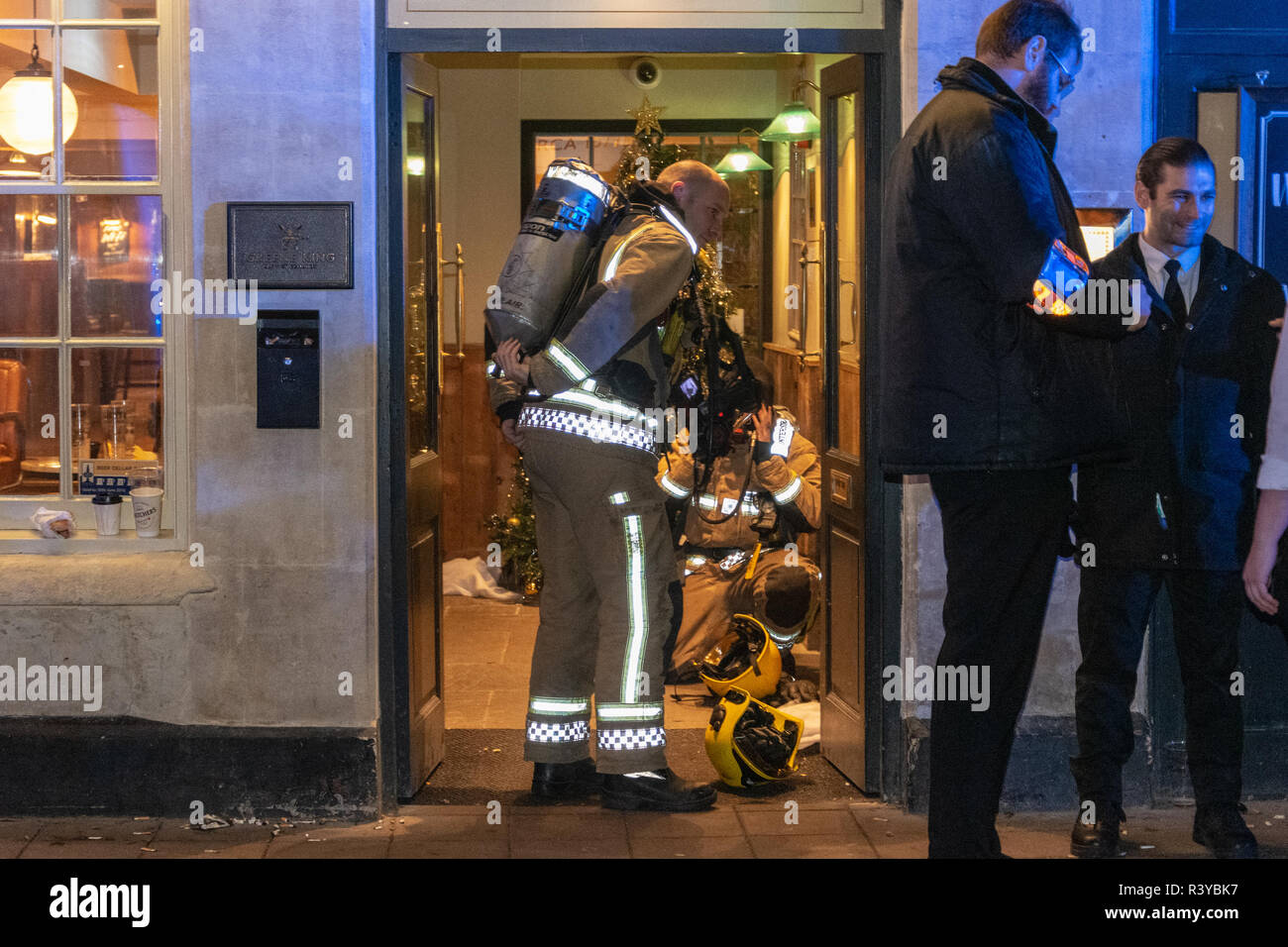 Bath Somerset UK, 24th November 2018  Fire crew putting on breathing apparatus  in doorway of Wesgate public house in bath somerset  Credit Estelle Bowden/Alamy Live News Stock Photo