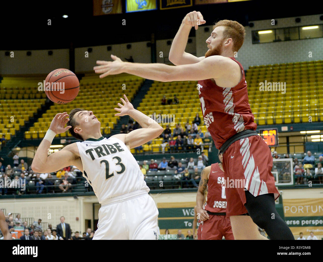 Williamsburg, VA, USA. 24th Nov, 2018. 20181124 - William and Mary forward JUSTIN PIERCE (23) and St. Joseph's forward ANTHONY LONGPRE (12) go for a rebound in the second half at Kaplan Arena in Williamsburg, Va. Credit: Chuck Myers/ZUMA Wire/Alamy Live News Stock Photo