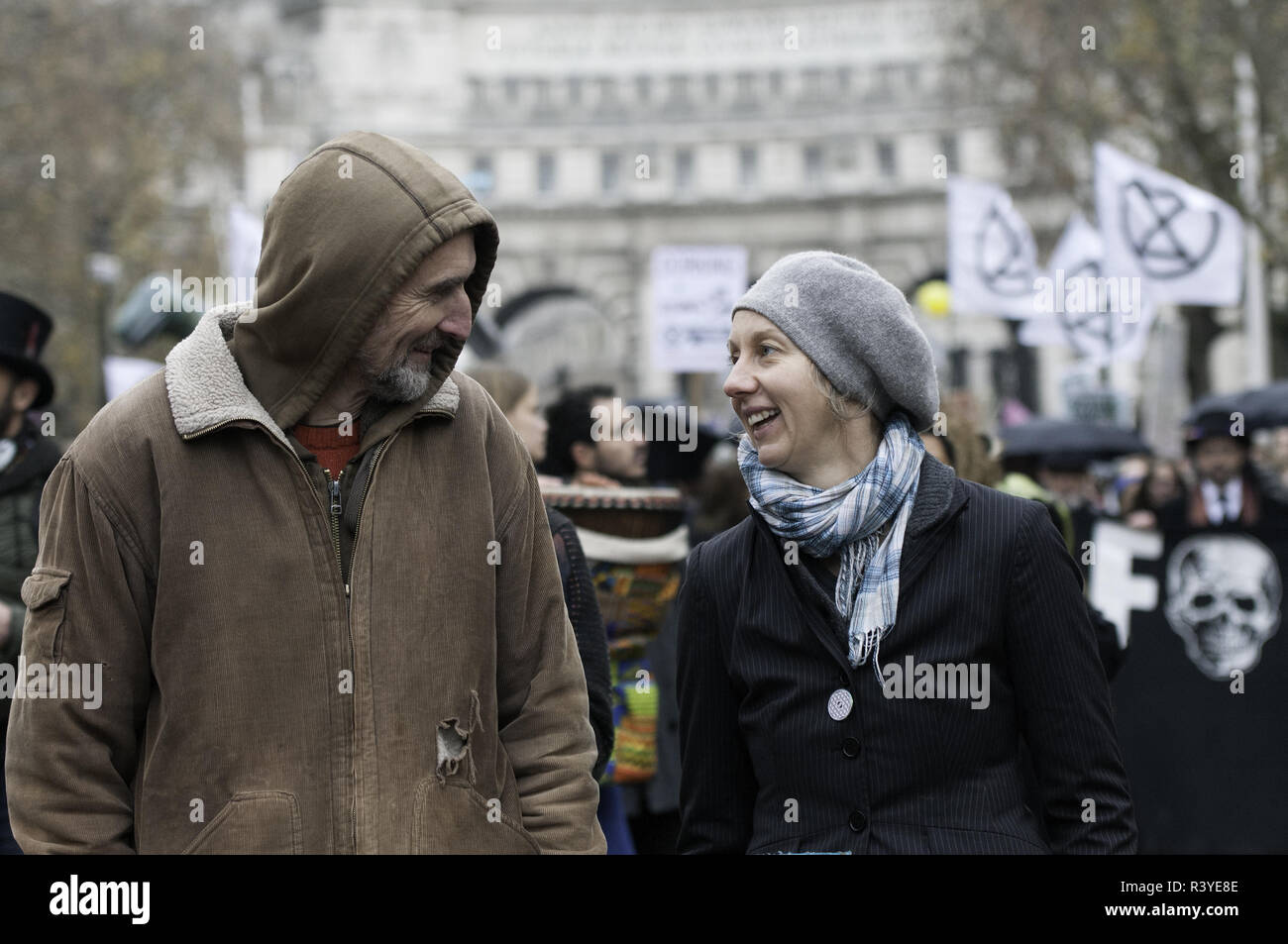 London, Greater London, UK. 24th Nov, 2018. Extinction Rebellion campaigners Roger Hallam (Left) and Dr Gail Bradbroock (Right) seen at the front of the march.Thousands of demonstrators from the new Extinction Rebellion climate change movement gathered at Parliament Square for a memorial and funeral march through London. Demonstrators paid homage to the lives lost due to climate change, and marched carrying a coffin from Parliament Square to Buckingham Palace. Credit: Andres Pantoja/SOPA Images/ZUMA Wire/Alamy Live News Stock Photo