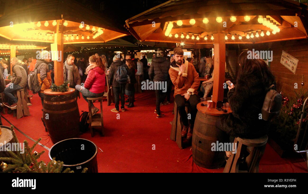 Glasgow, Scotland, UK 24th  November, 2018. The German market in st Enoch square combined with the Christmas lighting signaled the start of the festive season nightlife with its food and merchandise stalls. Gerard Ferry/Alamy news Stock Photo