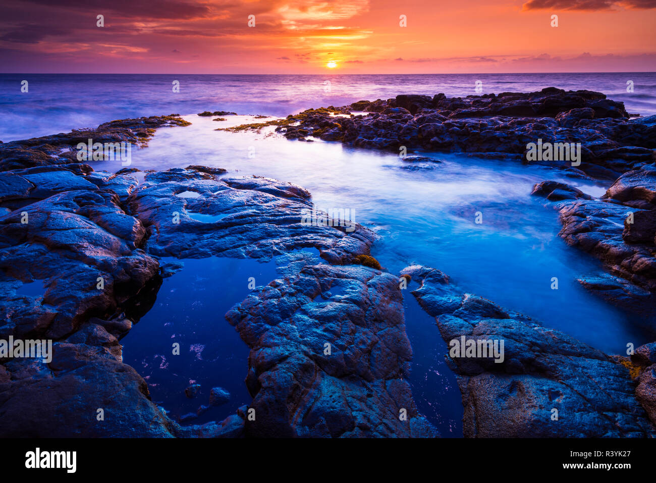 Sunset and tide pool above the Pacific, Kailua-Kona, Hawaii, USA Stock Photo