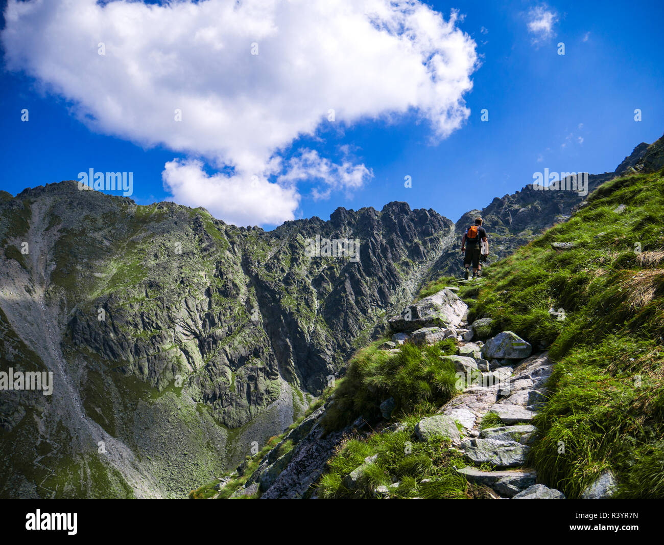Tourist on footpath in tatra mountains in tatra national park in Poland Stock Photo