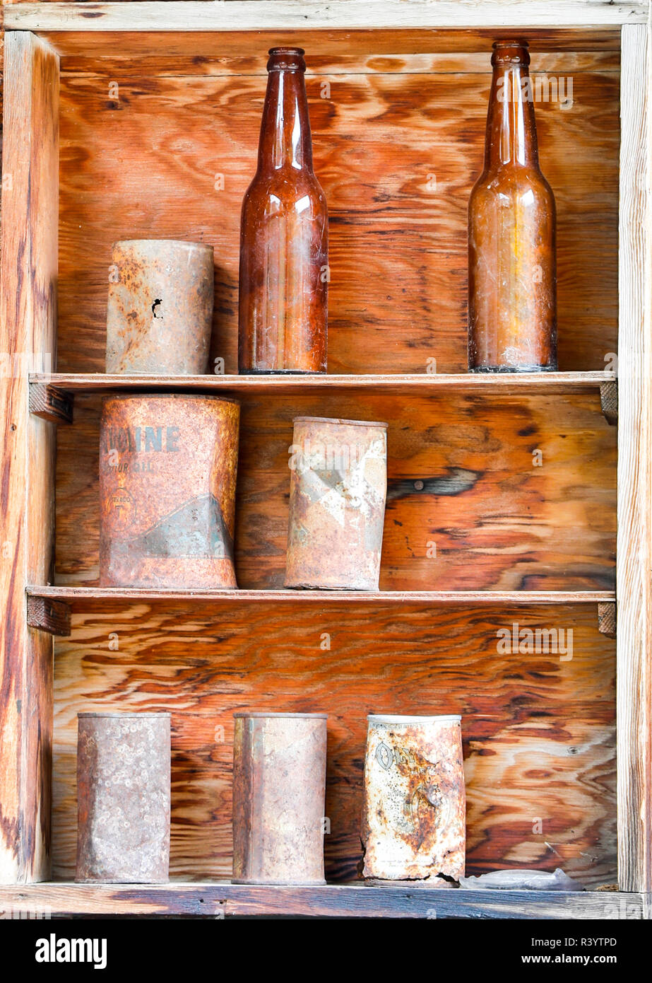 USA, Montana. Garnet, Ghost Town, Shelves of antique bottles and cans Stock Photo