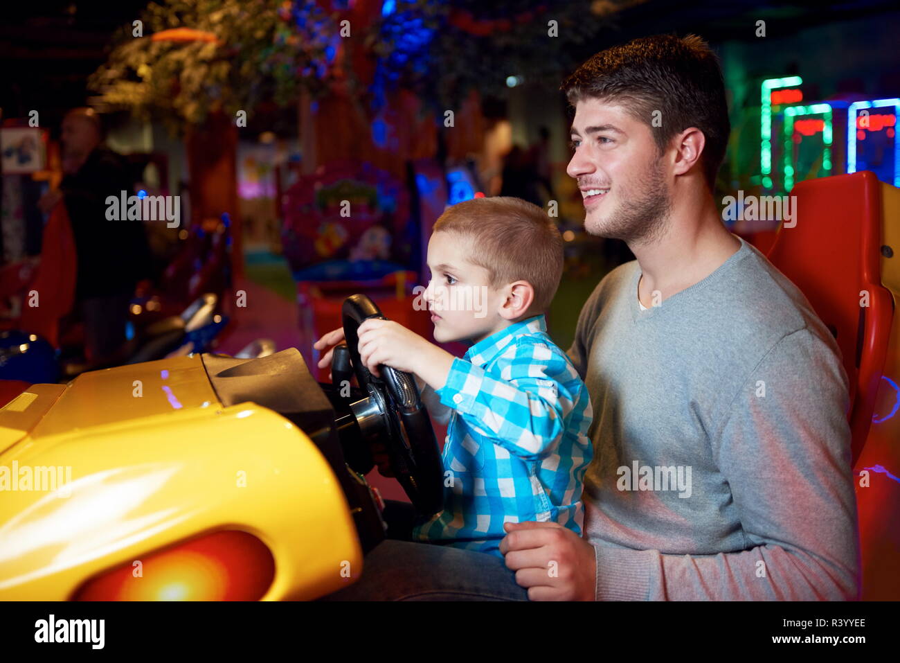 father and son playing game in playground Stock Photo - Alamy