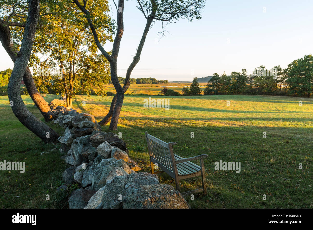 A stone wall and field at the Cox Reservation in Essex, Massachusetts. Stock Photo