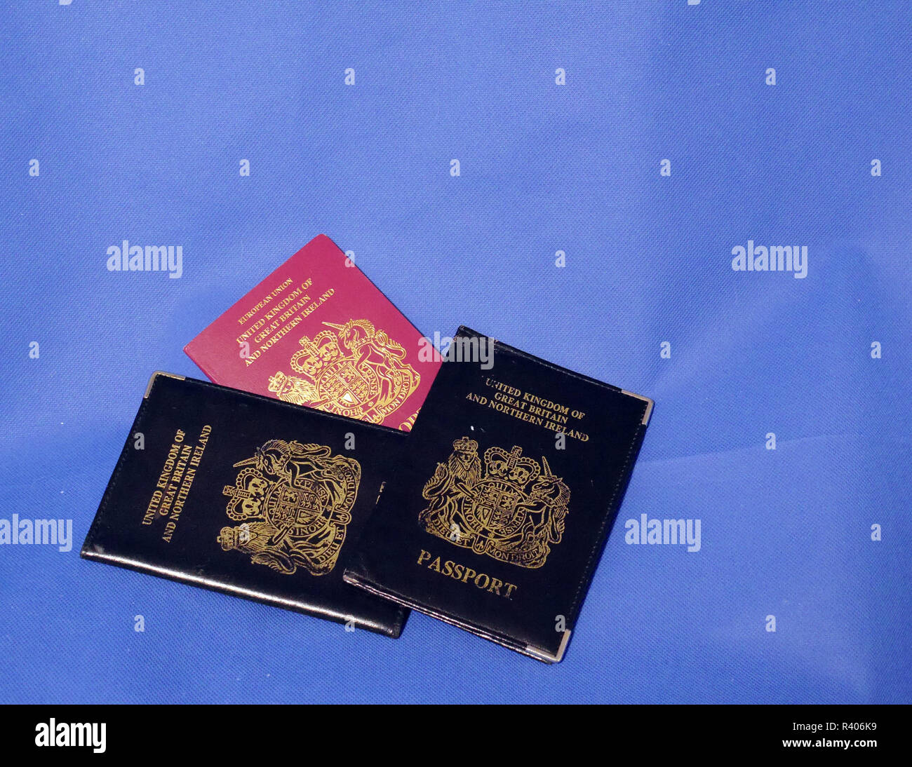 Multiple Passports. A selection of passports and holders showing pages