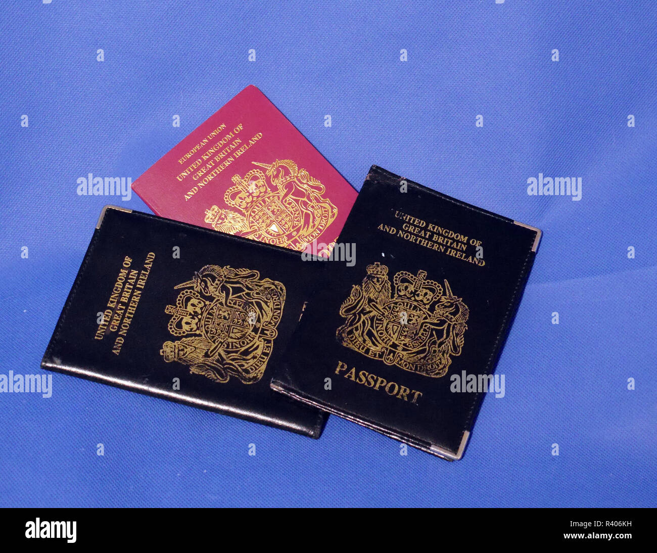 Multiple Passports. A selection of passports and holders showing pages in some and stamps Stock