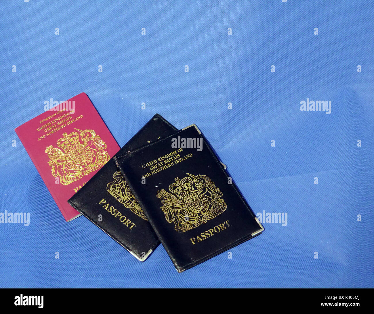Multiple Passports. A selection of passports and holders showing pages