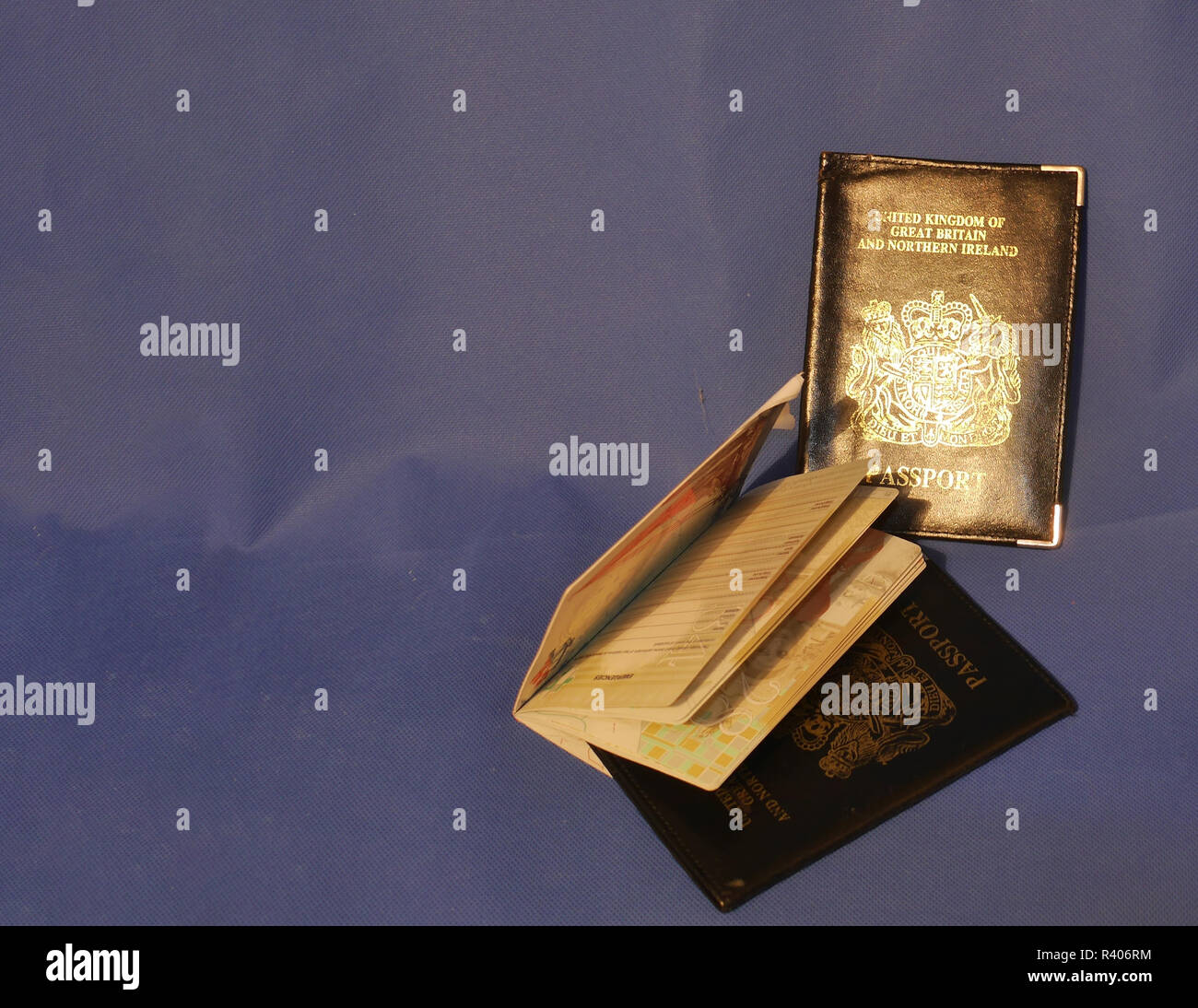 Multiple Passports. A selection of passports and holders showing pages