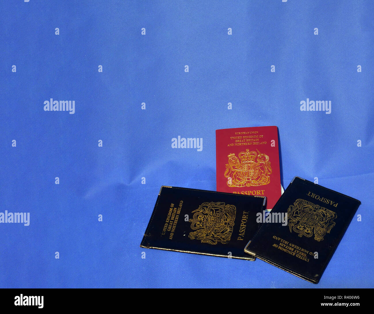 Multiple Passports. A selection of passports and holders showing pages in some and stamps Stock