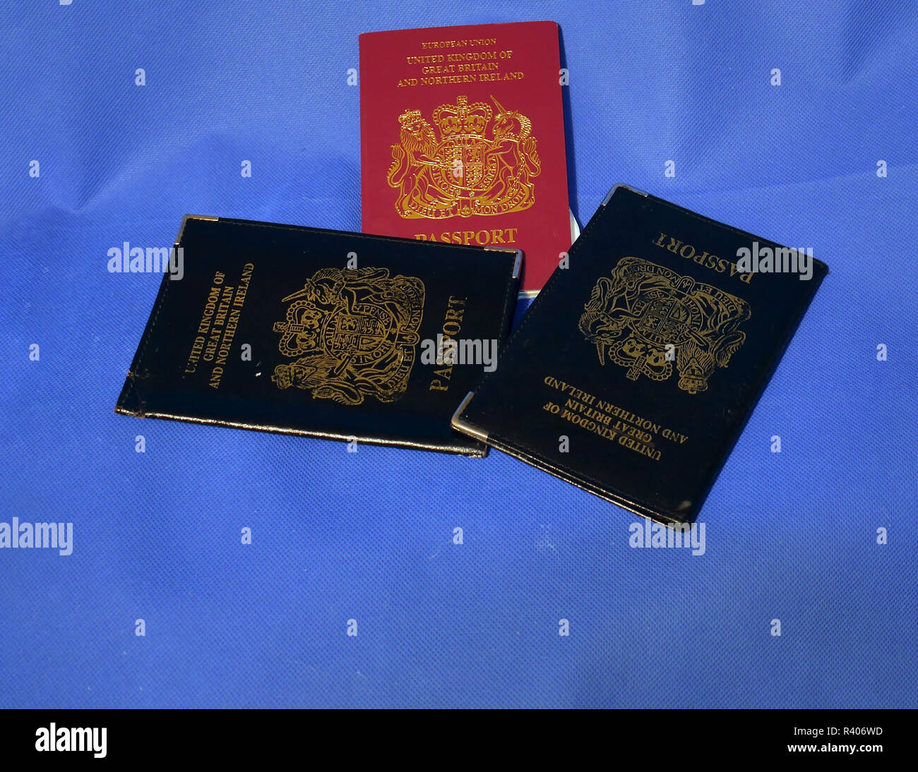Multiple Passports. A selection of passports and holders showing pages