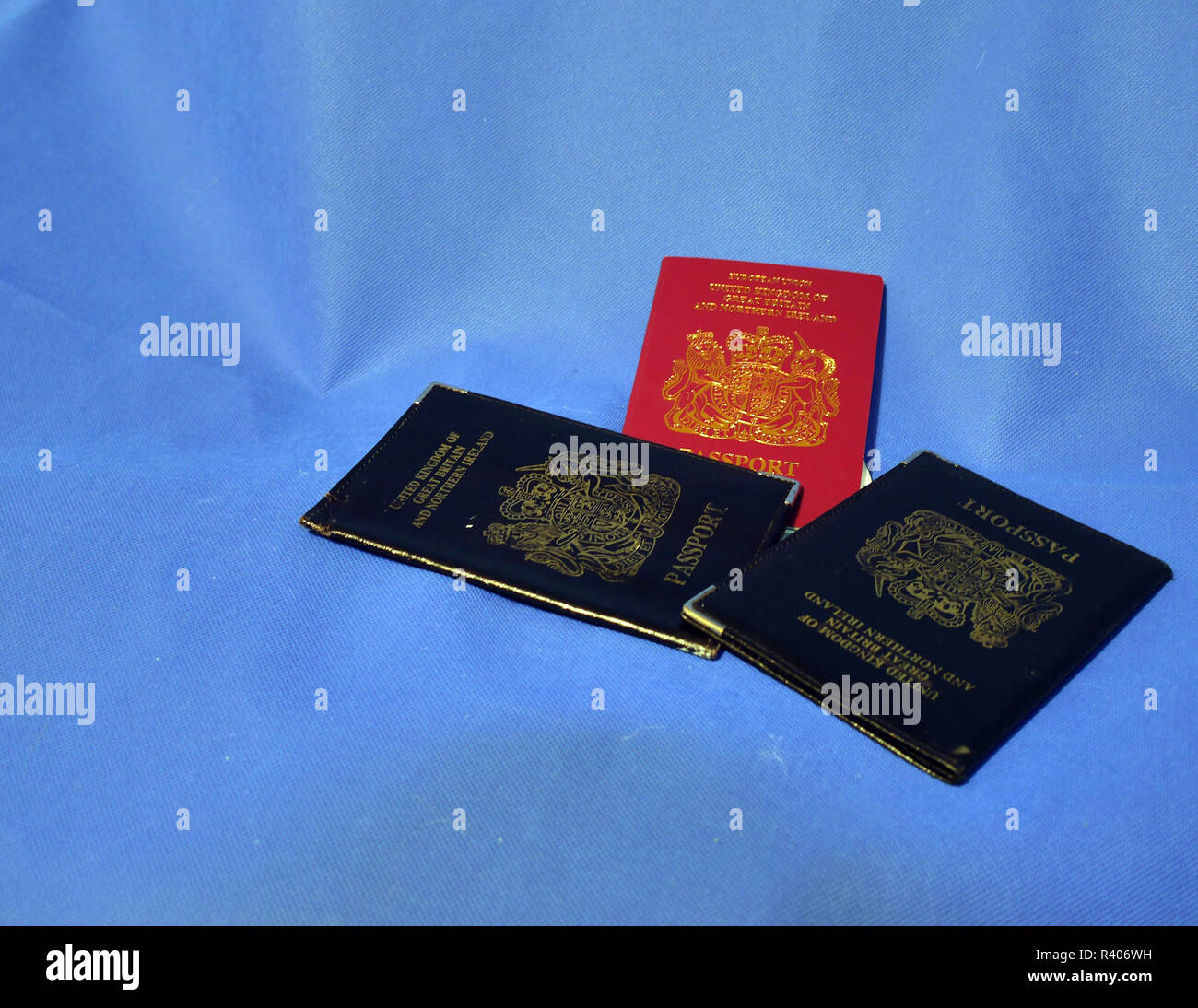 Multiple Passports. A selection of passports and holders showing pages