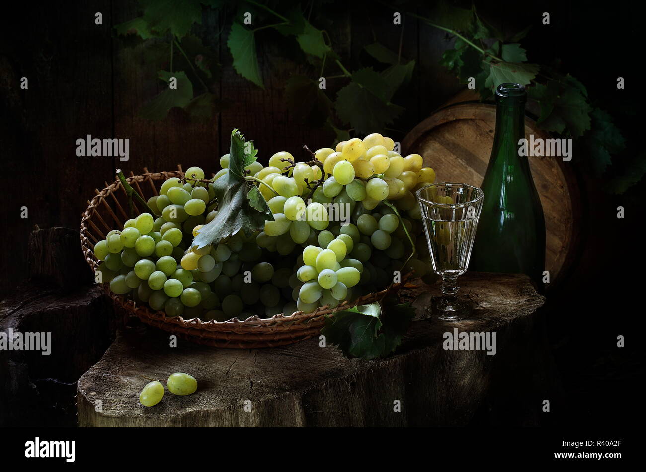 Still life with white wine and grapes Stock Photo - Alamy