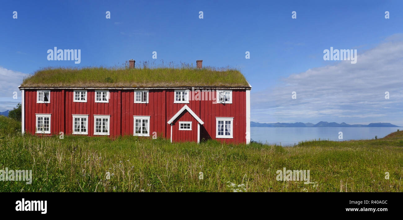 Image showcasing wooden house with green roofs in northern norway Stock Photo - Alamy