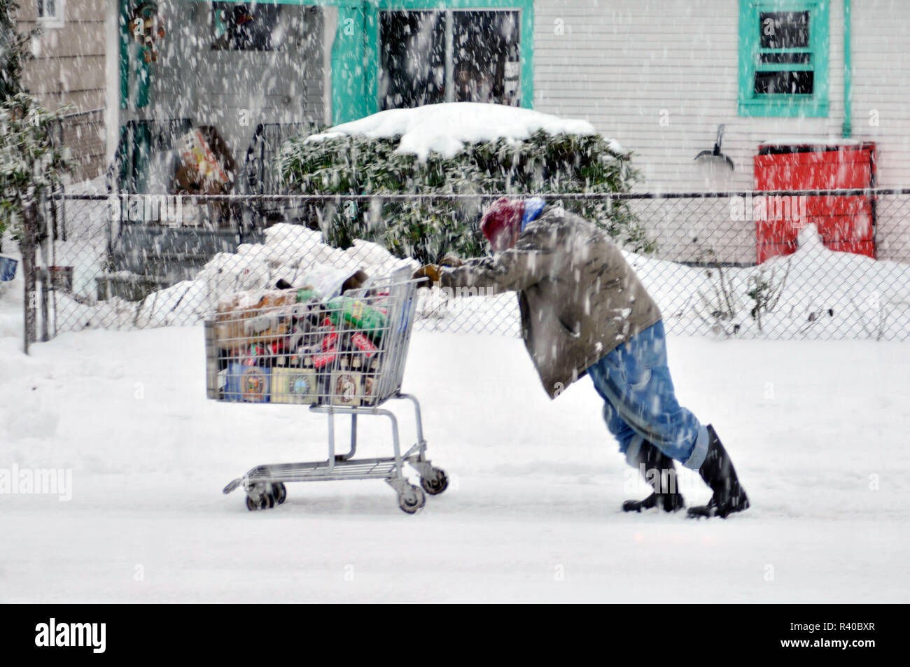 Homeless man pushing shopping cart hires stock photography and images
