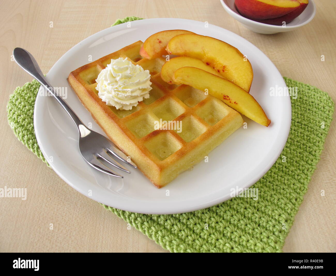 oven baked belgian waffles with peaches and cream Stock Photo Alamy