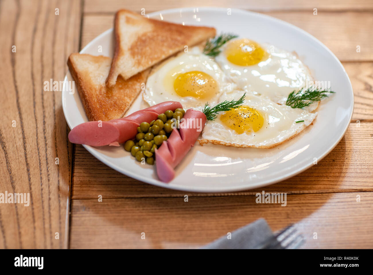 Breakfast food. American style breakfast with fried eggs, sausage