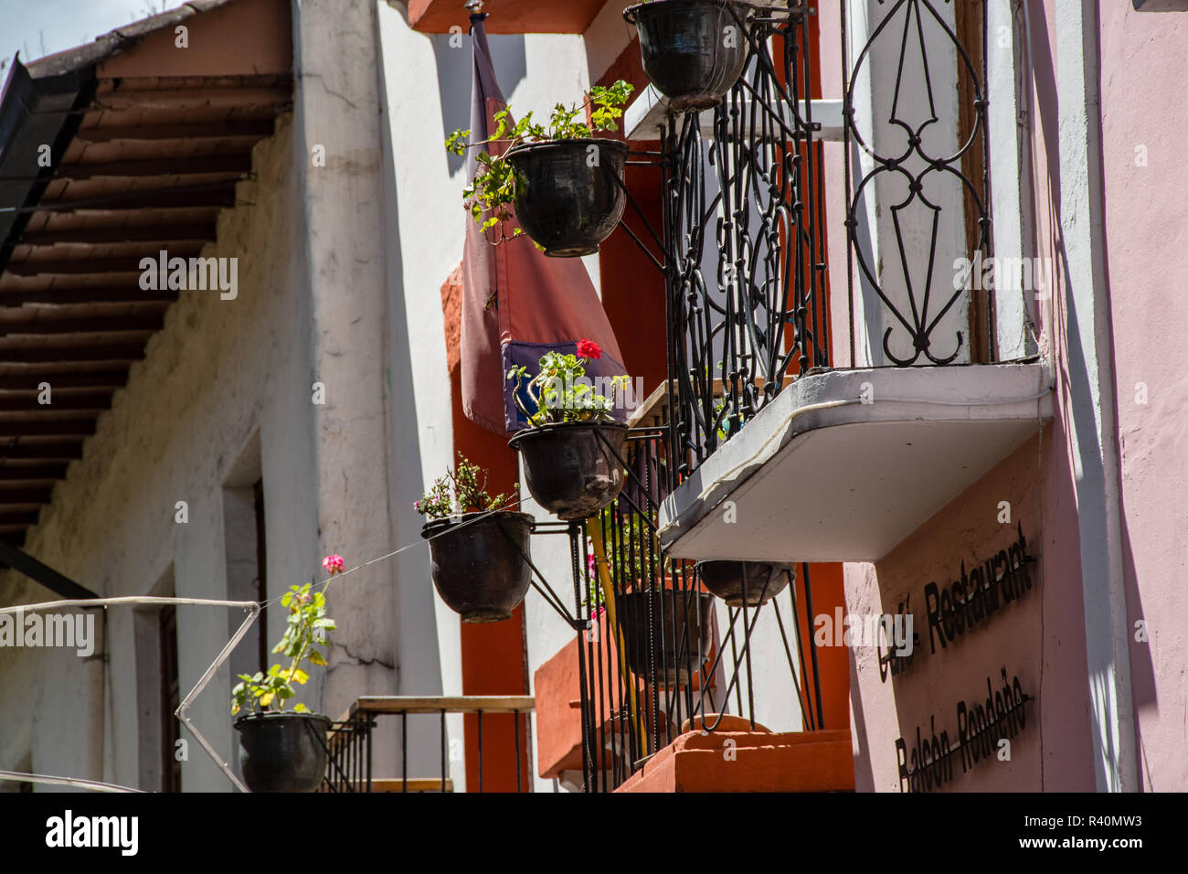 Balconies and geranium plants of the colonial houses of Ronda street in QuitoQuito Stock Photo