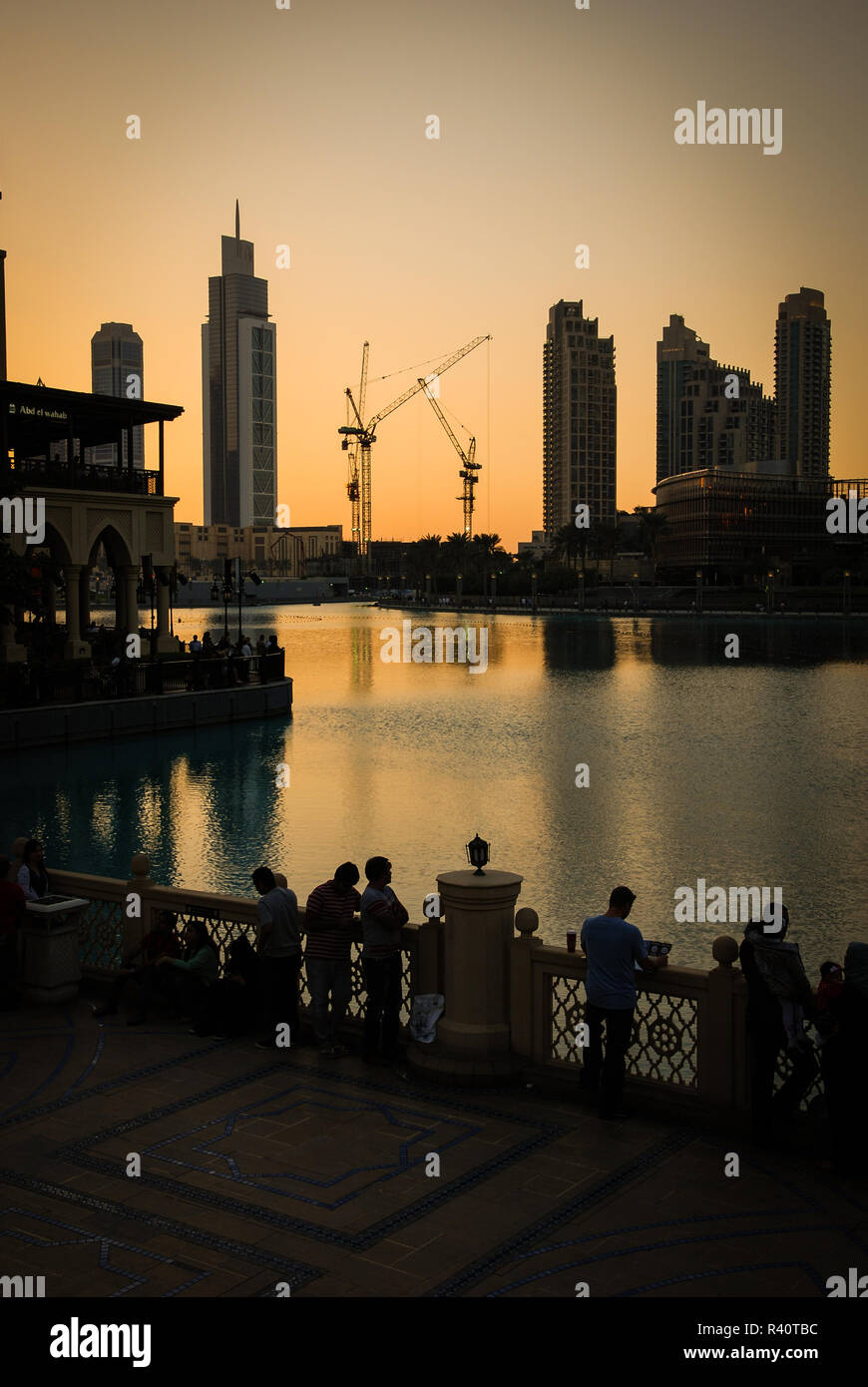 People watching the sunset below the Burj Khalifa Tower in Dubai Stock Photo