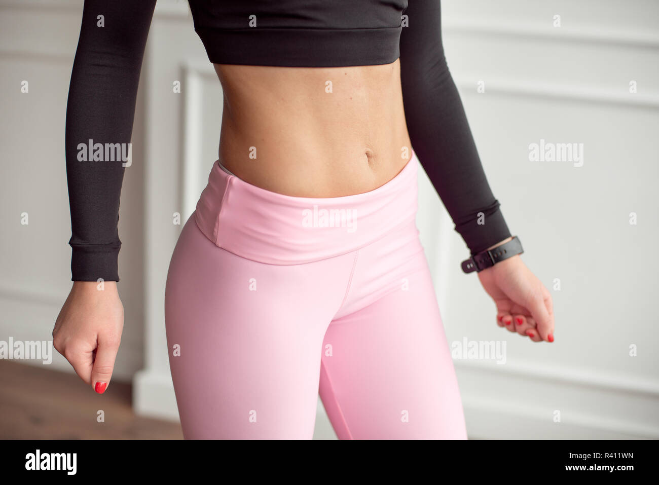 close-up athletic female body slim elegant waist of a stylish fitness model  with perfect figure lines after an effective training class, pumped up arm  Stock Photo - Alamy