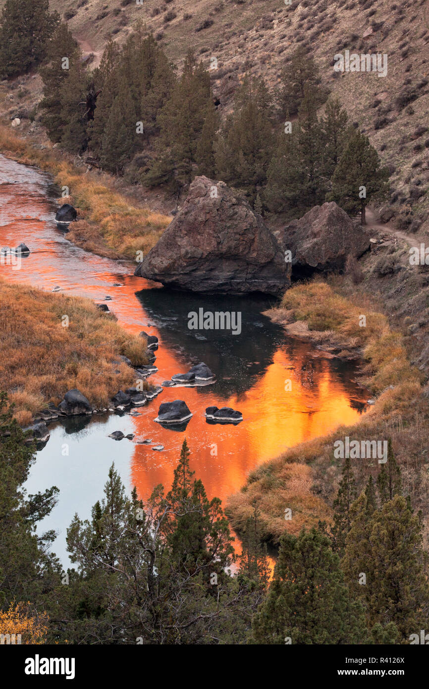 Sunrise reflection mirrored on Crooked River, Smith Rock State Park, near Redmond, Oregon Stock Photo