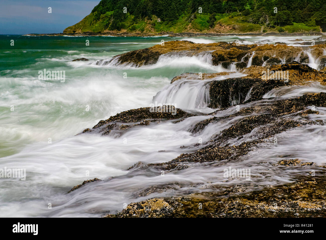 Long exposure of waves crashing on coastline, Cape Perpetua, Yachats, Oregon Stock Photo