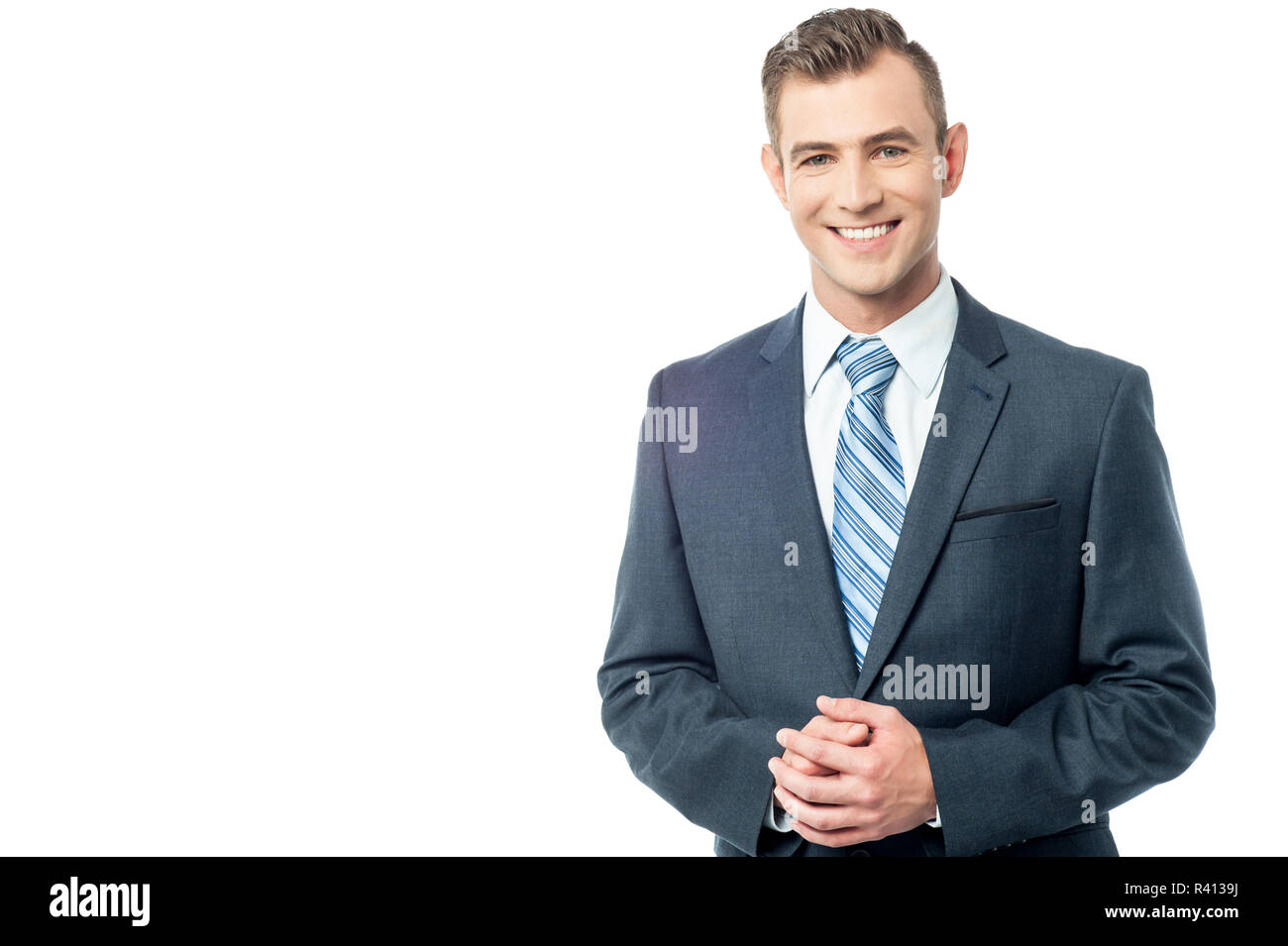 Confident business person, hands clasped Stock Photo