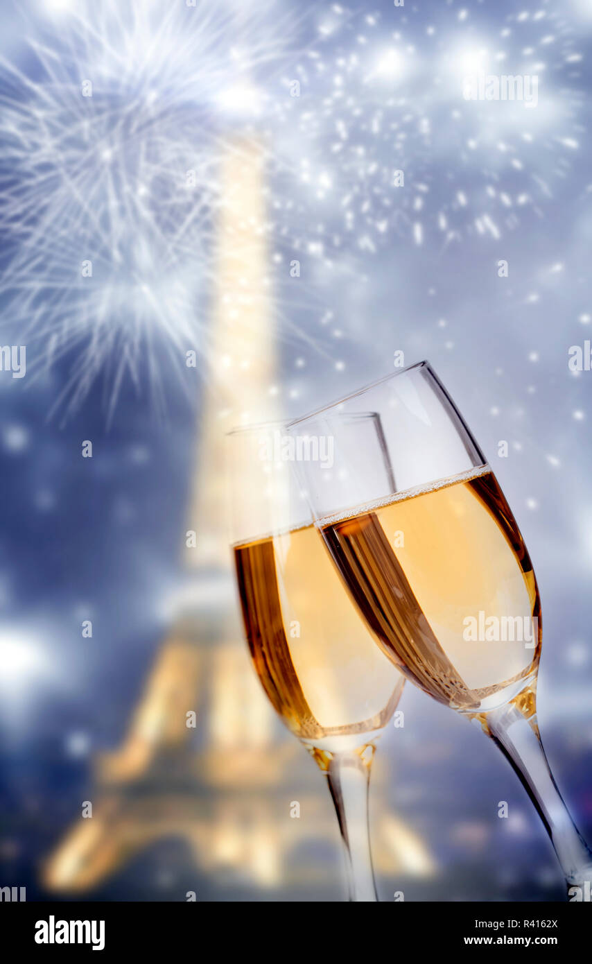 Close Up On Glasses Of Champagne Eiffel Tower And Fireworks In The Background Stock Photo Alamy